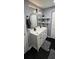 Modern bathroom featuring a double vanity, updated lighting, and sleek black hardware at 305 E Adalee St, Tampa, FL 33603