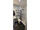 Bathroom featuring dark tile flooring and a shower stall with a decorative shower curtain at 305 E Adalee St, Tampa, FL 33603