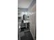 Bathroom featuring a pedestal sink, decorative plants and updated hardware at 305 E Adalee St, Tampa, FL 33603
