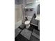 This bathroom has a shower and tub combo with decorative towels and plants at 305 E Adalee St, Tampa, FL 33603