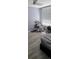 Bedroom with refinished hardwood floors and plenty of natural light at 305 E Adalee St, Tampa, FL 33603