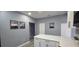 Modern kitchen featuring granite countertops, all-white cabinetry, and updated appliances at 305 E Adalee St, Tampa, FL 33603