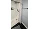 Modern tiled shower features a rainfall shower head, handheld sprayer, and sleek fixtures at 305 E Adalee St, Tampa, FL 33603