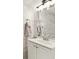 Bright bathroom featuring a white vanity, sleek faucet, and large mirror at 3077 Branch Dr, Clearwater, FL 33760