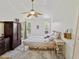 Bedroom features a decorative ceiling fan, closet, and bright natural light at 3077 Branch Dr, Clearwater, FL 33760