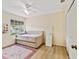 Charming bedroom features a daybed, ceiling fan and large window for natural light at 3077 Branch Dr, Clearwater, FL 33760