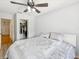 Bright bedroom with a ceiling fan and closet, offering comfort and convenience at 3077 Branch Dr, Clearwater, FL 33760