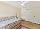Well-lit bedroom showcases neutral tones, ceiling fan and closet for organized storage at 3077 Branch Dr, Clearwater, FL 33760