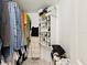 Walk-in closet with ample storage space, including hanging racks and shelving at 3077 Branch Dr, Clearwater, FL 33760