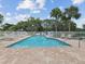 Enjoy the sunshine by this community pool with lounge chairs and well-kept fencing, great for relaxing at 3077 Branch Dr, Clearwater, FL 33760