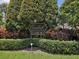 The Overlook sign sits among lush greenery at this deed-restricted community at 3077 Branch Dr, Clearwater, FL 33760