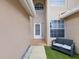 Inviting front entrance with a cozy sitting area and a well-lit doorway, creating a welcoming first impression at 3077 Branch Dr, Clearwater, FL 33760