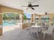 Inviting covered patio area with views of a sparkling community pool and well-maintained outdoor seating at 3077 Branch Dr, Clearwater, FL 33760