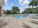 Relaxing pool deck with sun loungers and views of lush landscaping, perfect for enjoying sunny days at 3077 Branch Dr, Clearwater, FL 33760