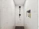 Modern shower with sleek black fixtures, white marble-look tiling, and built-in niche at 3077 Branch Dr, Clearwater, FL 33760