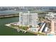 Aerial view showcasing the building's waterfront location, pool, and dock, offering scenic views at 31 Island Way # 502, Clearwater Beach, FL 33767