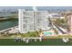 Aerial view of the condos and a pristine pool surrounded by waterfront condos at 31 Island Way # 502, Clearwater Beach, FL 33767