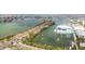 Breathtaking aerial view of a waterfront community with sailboat dotted harbor and cityscape in the background at 31 Island Way # 502, Clearwater Beach, FL 33767