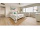 Cozy bedroom with coastal-themed decor, bright windows, and light wood flooring, offering a relaxing retreat at 31 Island Way # 502, Clearwater Beach, FL 33767