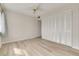 Bright bedroom features laminate wood floors, ceiling fan, and spacious closet at 31 Island Way # 502, Clearwater Beach, FL 33767