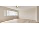 Bright bedroom offers wood-look floors, a ceiling fan, and expansive windows at 31 Island Way # 502, Clearwater Beach, FL 33767