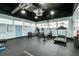 Well-equipped gym featuring modern cardio equipment, fitness charts, and ample natural light for an energizing workout space at 31 Island Way # 502, Clearwater Beach, FL 33767