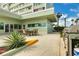 Outdoor patio with a dining table and a grill perfect for entertaining at 31 Island Way # 502, Clearwater Beach, FL 33767
