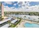 Poolside view showing boat docks and neighborhood overlooking a peaceful waterfront community at 31 Island Way # 502, Clearwater Beach, FL 33767