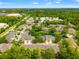 Aerial view of a residential community with mature trees, water features and well-maintained exteriors on a sunny day at 3519 Heards Ferry Dr, Tampa, FL 33618