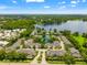 An aerial view of a neighborhood community with lake views, mature landscaping, and beautiful homes on a clear day at 3519 Heards Ferry Dr, Tampa, FL 33618