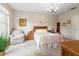A bright bedroom features a large window with lots of natural light and a cozy seating area at 3519 Heards Ferry Dr, Tampa, FL 33618