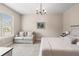 Bedroom with a neutral palette, a large window, a ceiling fan, and a comfortable daybed at 3519 Heards Ferry Dr, Tampa, FL 33618