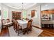 Elegant dining area featuring a large table, ample seating, and natural light from surrounding windows at 3519 Heards Ferry Dr, Tampa, FL 33618