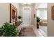 Welcoming foyer with tile flooring, elegant decor, and a view into the adjacent living room at 3519 Heards Ferry Dr, Tampa, FL 33618