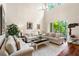 Spacious living room featuring high ceilings, comfortable seating, and a view of the outdoors at 3519 Heards Ferry Dr, Tampa, FL 33618