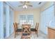 Cozy breakfast nook features a glass top table and views of the outside at 37526 New Horizons Blvd, Zephyrhills, FL 33541
