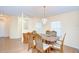 Bright dining room with wood flooring and chandelier, perfect for gatherings at 37526 New Horizons Blvd, Zephyrhills, FL 33541