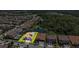 This aerial view highlights the property's location within a community with a lake and trees at 3999 Burdick Loop, Odessa, FL 33556