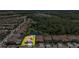 This aerial view showcases the property and its proximity to a lake and treeline at 3999 Burdick Loop, Odessa, FL 33556