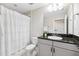 Clean bathroom with shower, vanity and mirror, offering a refreshing space at 3999 Burdick Loop, Odessa, FL 33556