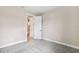 A bright bedroom with an open door and a view of the staircase at 3999 Burdick Loop, Odessa, FL 33556