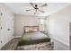 Cozy bedroom with a rustic wood bed frame and soft, neutral tones, creating a peaceful retreat at 3999 Burdick Loop, Odessa, FL 33556