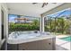Relax in the hot tub with privacy and views of the lush landscaping and community at 3999 Burdick Loop, Odessa, FL 33556