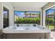 Hot tub provides the perfect retreat with views of the backyard and serene surroundings at 3999 Burdick Loop, Odessa, FL 33556