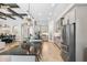 Expansive kitchen boasting gray cabinetry, large island, and stainless steel appliances at 3999 Burdick Loop, Odessa, FL 33556