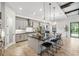 Spacious kitchen features an island with bar seating, modern appliances, and stylish pendant lighting at 3999 Burdick Loop, Odessa, FL 33556