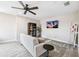 Bright and airy living room with ceiling fan and modern décor, perfect for relaxation at 3999 Burdick Loop, Odessa, FL 33556