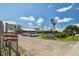 Exterior view of Starkey Market, showcasing the entrance, windmill, and ample parking at 3999 Burdick Loop, Odessa, FL 33556