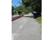 Peaceful street view with well-kept grounds and mature foliage at 4350 2Nd S Ave, St Petersburg, FL 33711