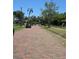 Charming brick street with mature trees and lush landscaping creates a welcoming neighborhood feel at 4350 2Nd S Ave, St Petersburg, FL 33711